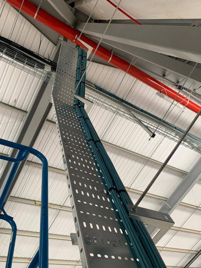 Perforated cable tray run at high level carrying data cabling